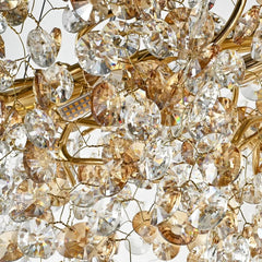 Close-up of a crystal chandelier with gold accents