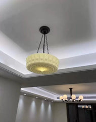Decorative ceiling light fixture in a room with a modern design.