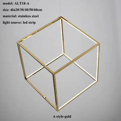 Gold geometric light fixture with LED strip on a gray background