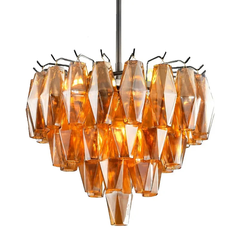 Amber faceted crystal chandelier with a tiered design illuminating a living room.