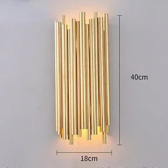 Gold cylindrical wall light fixture with dimensions on a gray background