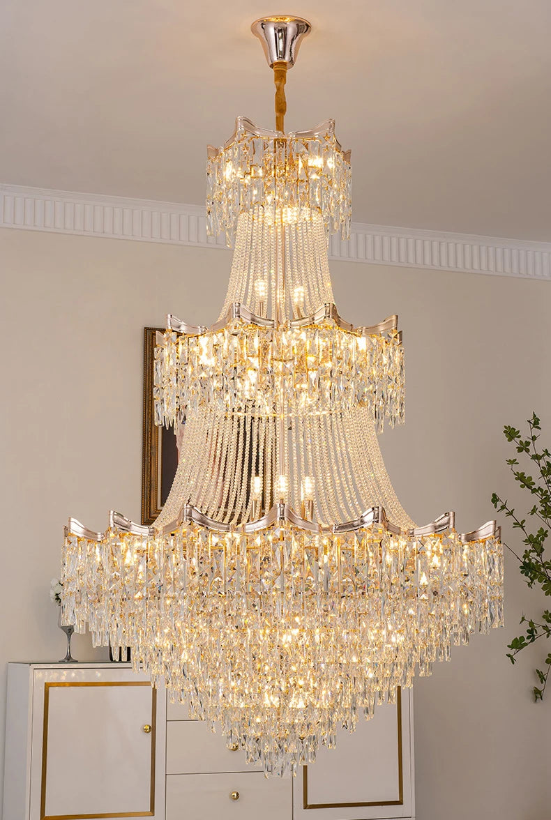 Luxurious crystal chandelier hanging in a room with a neutral color scheme.