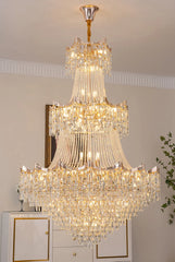 Luxurious crystal chandelier hanging in a room with a neutral color scheme.