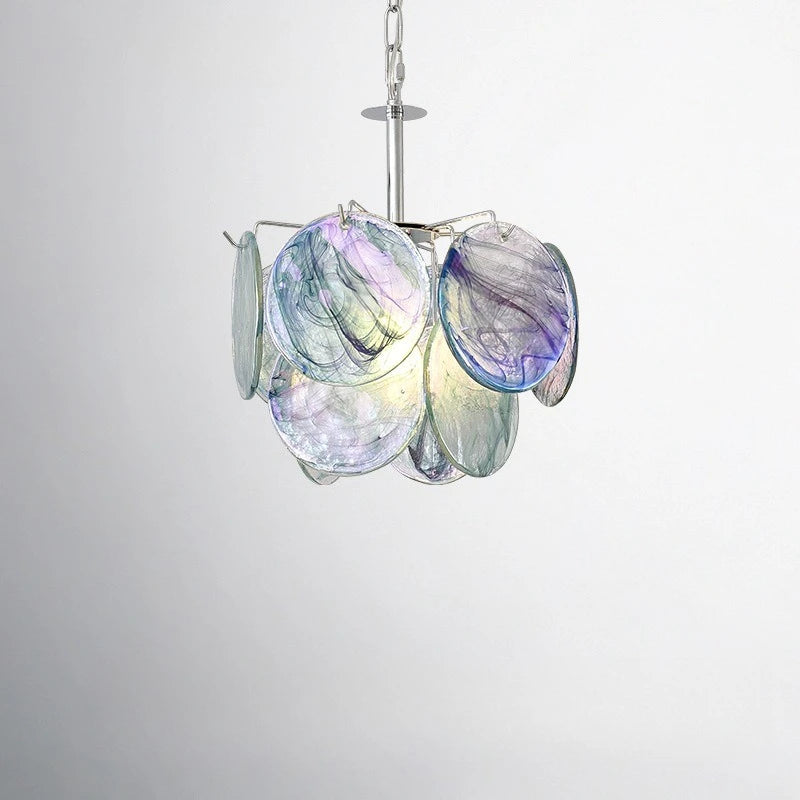 Close-up view of the swirling blue and purple glass discs on a pendant light fixture.