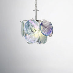 Close-up view of the swirling blue and purple glass discs on a pendant light fixture.