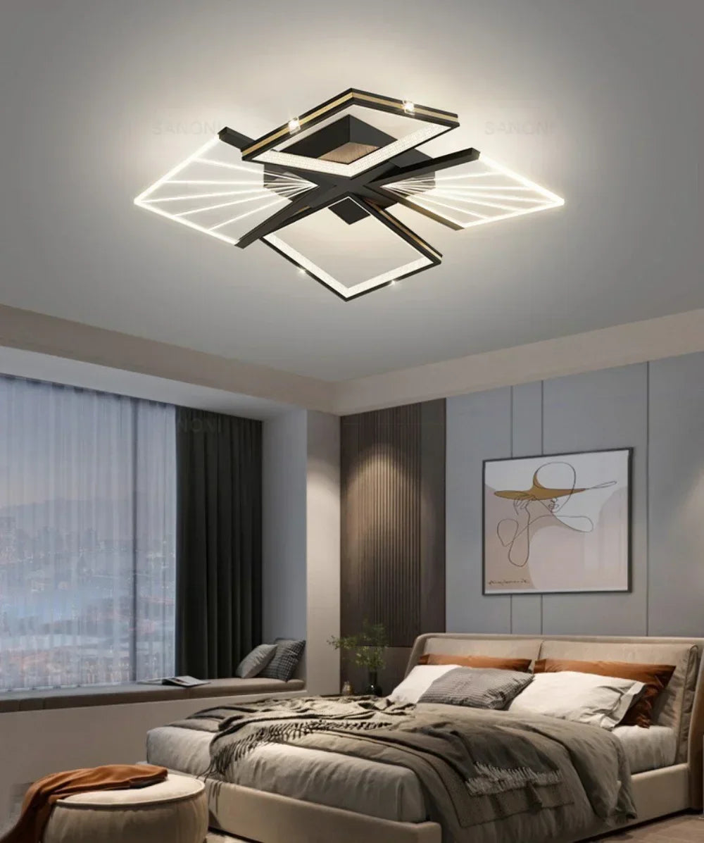 Modern geometric LED ceiling light with black and gold accents, illuminating a bedroom.