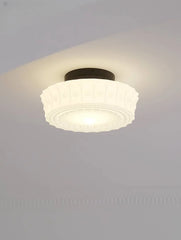 Ceiling light fixture on a plain wall