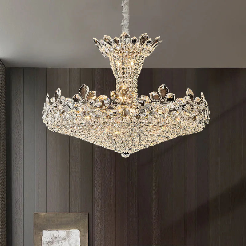 Close-up view of the polished chrome tiered chandelier, showcasing detailed crystal and floral elements.