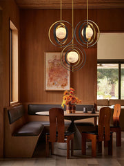 Dining room with wooden furniture, round table, and decorative lights.