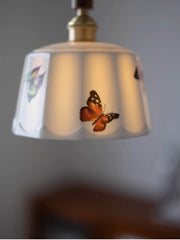 Lampshade with butterfly design on a blurred background