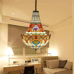 A Tiffany-style stained glass chandelier with a polished chrome metal frame, showcasing intricate colorful patterns.