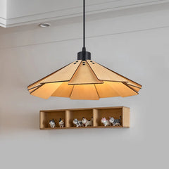 Close-up of a tiered geometric pendant light made of natural wood, illuminated from within.