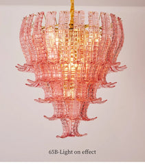 Pink glass chandelier on a plain background