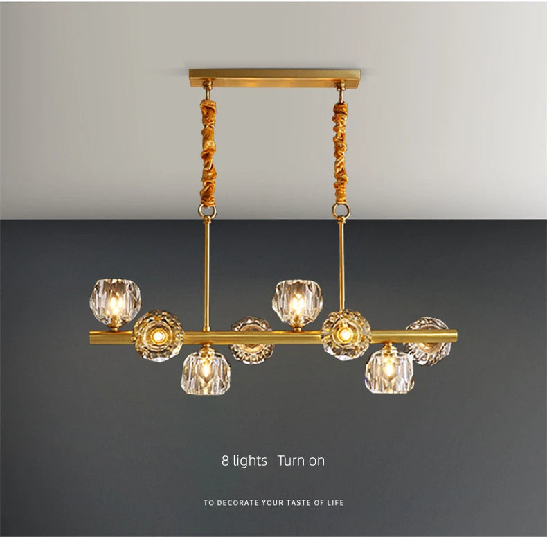 Gold chandelier with crystal shades on a gray background