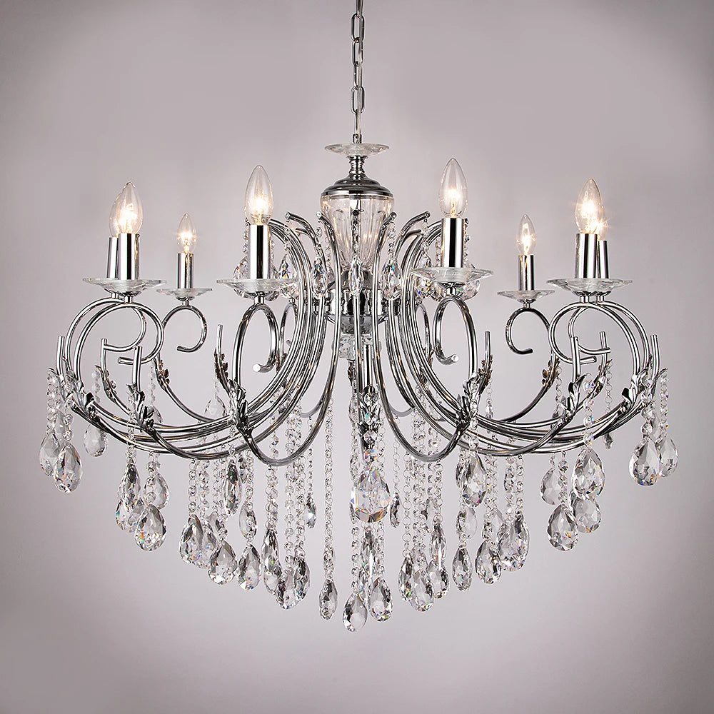 Polished gold candelabra chandelier with cascading crystals and candle-style lights, shown against a light gray background.