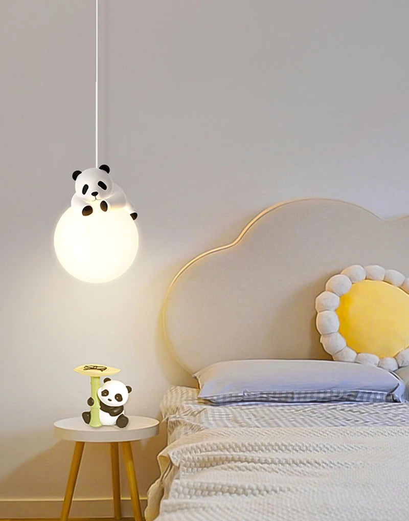 Children's bedroom with panda-themed lamp and nightlight.