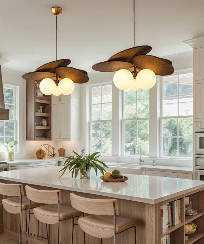 Modern kitchen with pendant lights and a dining area