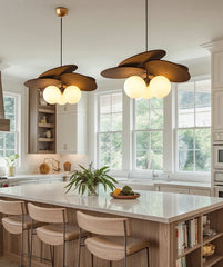 Modern kitchen with pendant lights and a dining area