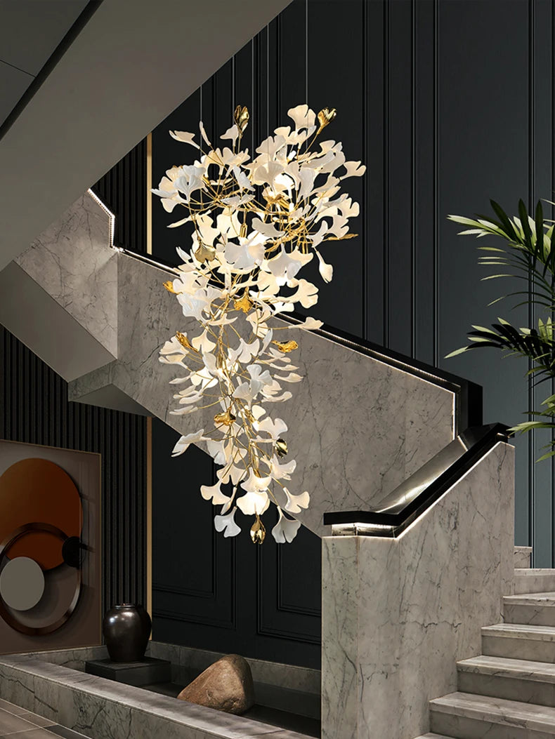 Modern staircase with a decorative chandelier in a stylish interior setting.