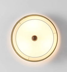 Round ceiling light fixture on a white ceiling