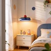 Blue oval pendant light with red accent hanging in a child's bedroom above a nightstand.