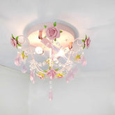 Close-up of a pink rose bouquet semi-flush ceiling light with crystal teardrop accents and a white painted metal frame.