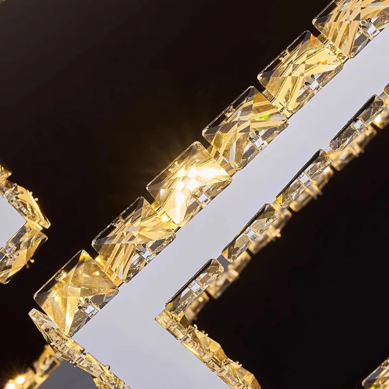 Close-up of a decorative border with gold and clear crystals on a black background