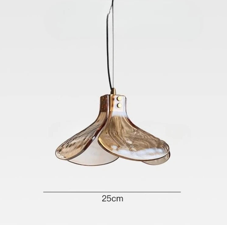 Modern pendant light with gold finish on a white background