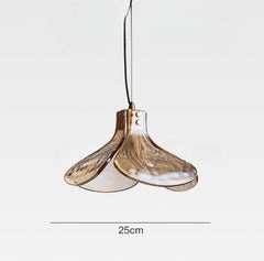 Modern pendant light with gold finish on a white background