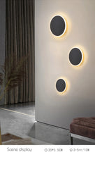 Modern Black Round LED Wall Sconce with Subtle Halo Light Effect