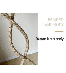 Braided rattan lamp body against a neutral background