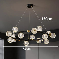 Modern chandelier with crystal-like spherical lights on a dark ceiling.