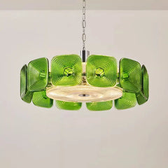 Green glass square geometric chandelier shown hanging from a chain against a plain background.
