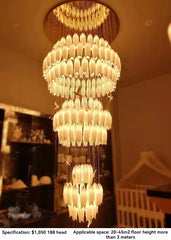 Large chandelier hanging from a ceiling with a blurred background