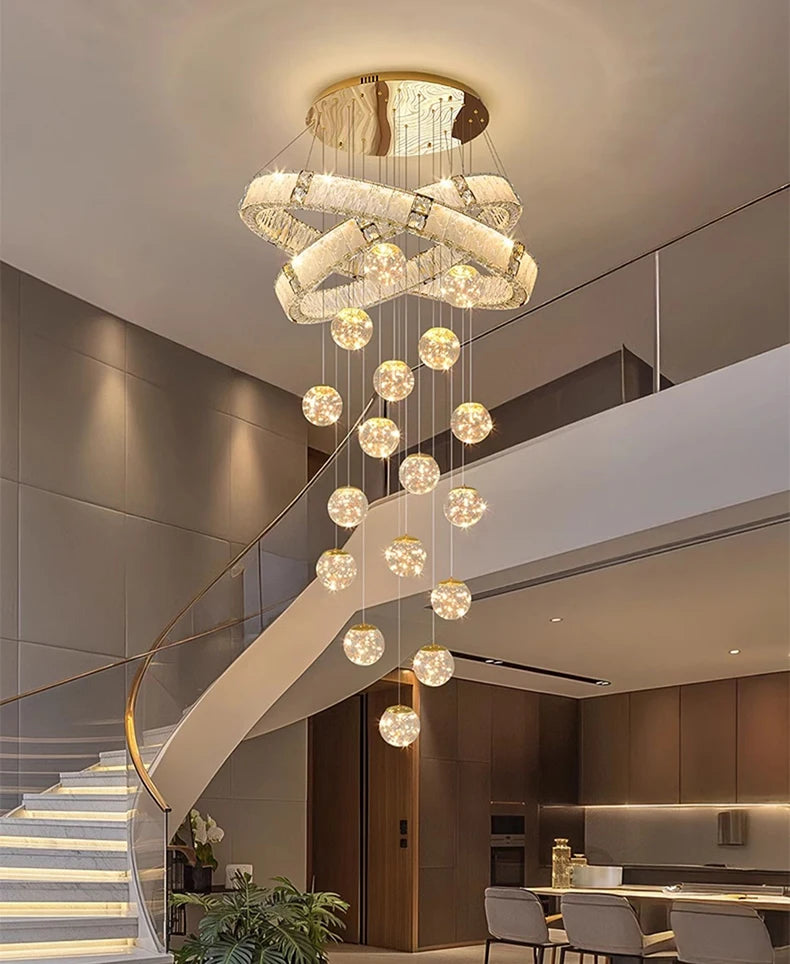 Chandelier hanging above a staircase in a modern interior setting