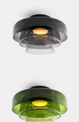 Modern ceiling light fixture with black and green design on a white background