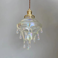Glass pendant light with a unique design on a plain background