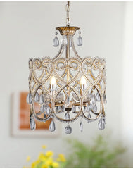 Decorative chandelier with crystal accents on a neutral background