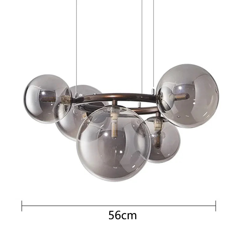 Chandelier with glass spheres and metal frame, labeled with a measurement of 56cm.