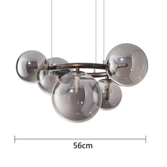 Chandelier with glass spheres and metal frame, labeled with a measurement of 56cm.