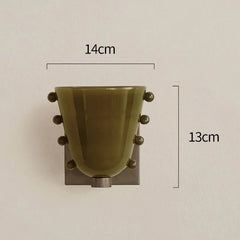 Decorative wall hook with dimensions on a plain background