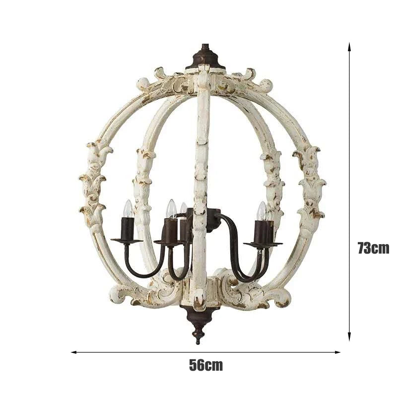 Dimensional diagram showing a distressed white carved wood globe chandelier with height 73cm and width 56cm.