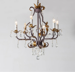 Decorative chandelier with crystal accents on a gray background