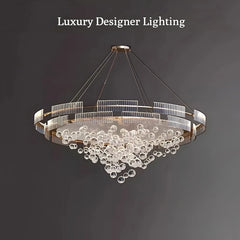 Luxury chandelier with 'Luxury Designer Lighting' text on a dark background