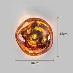 Amber-colored wall light fixture with dimensions on a gray background