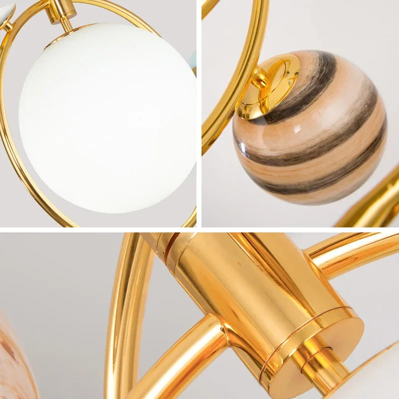 Close-up of a gold lamp with a white shade and wooden accent on a light gray background.