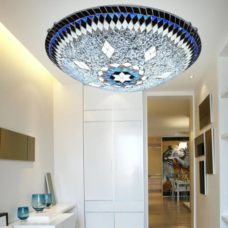 Glass mosaic starburst flush mount ceiling light in a hallway