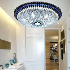 Glass mosaic starburst flush mount ceiling light in a hallway