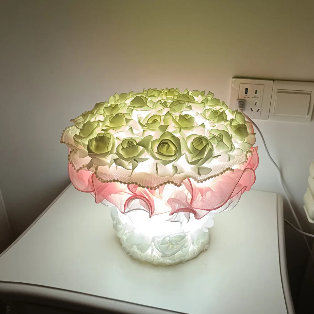 Decorative lamp with floral design on a white surface