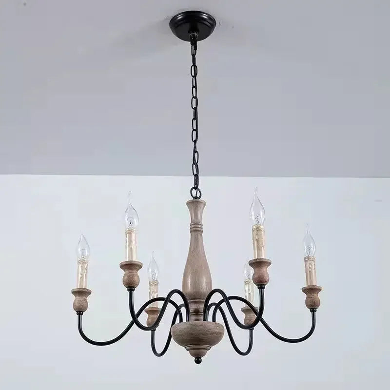Wooden chandelier with five candle-style lights on a white background